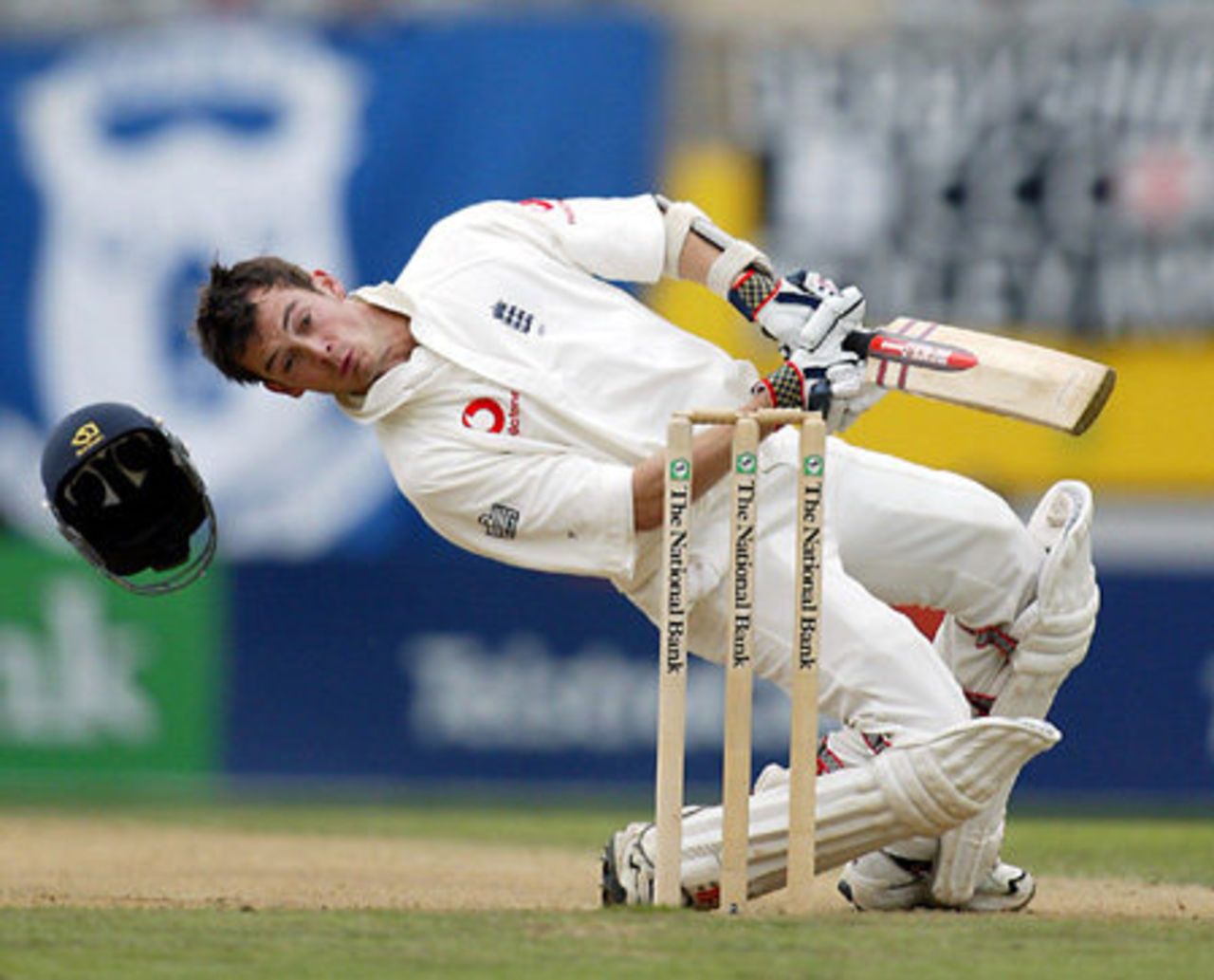 England batsman James Foster loses his helmet as he sways back to avoid a short delivery from New Zealand bowler Andre Adams during his second innings of 23. 3rd Test: New Zealand v England at Eden Park, Auckland, 30 March-3 April 2002 (3 April 2002).