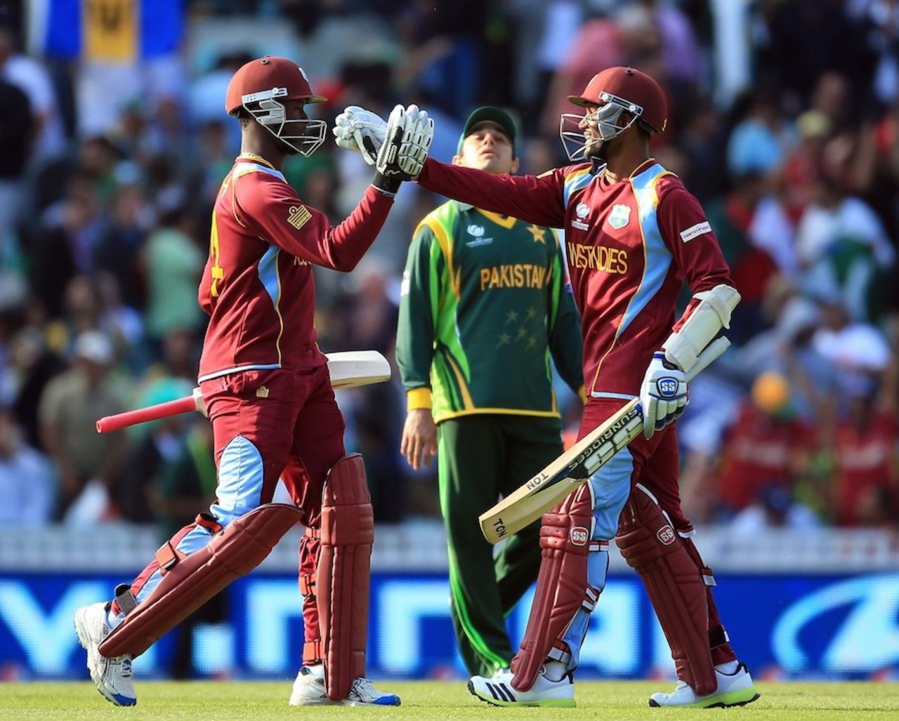 Denesh Ramdin and Kemar Roach celebrate a tense win, West Indies v Pakistan, Champions Trophy, Group B, The Oval, June 7, 2013