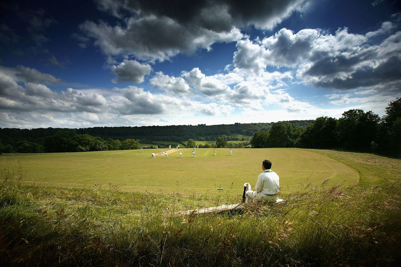 A cricketer waits for his turn to bat at Sheepscombe Cricket Club, Sheepscombe, June 14, 2005