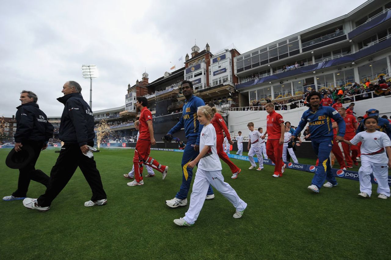The umpires and players walk on to the field for the national anthems, England v Sri Lanka, Champions Trophy, Group A, The Oval, June 13, 2013