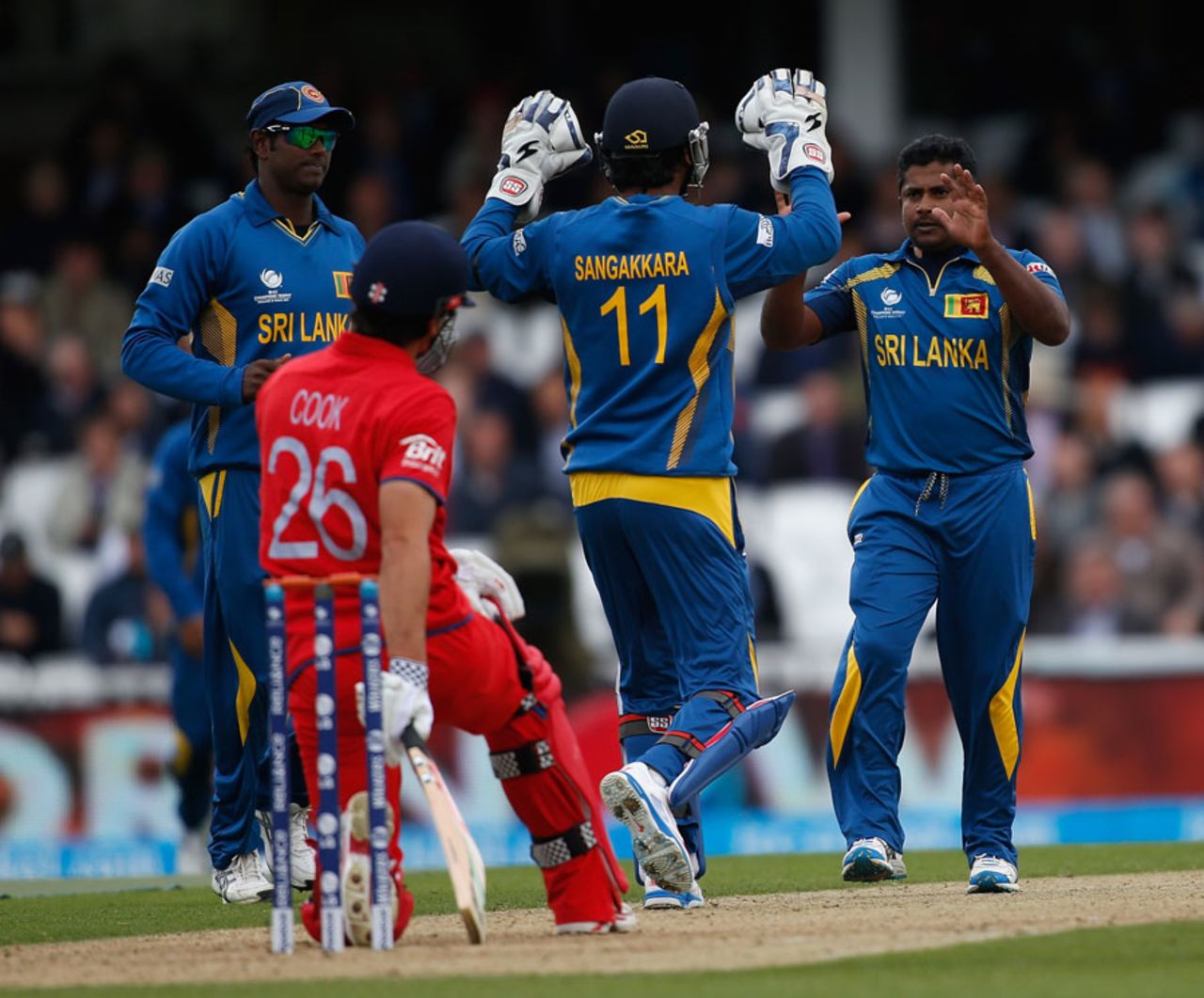 Rangana Herath and Kumar Sangakkara celebrate after the umpire rules Alastair Cook out, England v Sri Lanka, Champions Trophy, Group A, The Oval, June 13, 2013