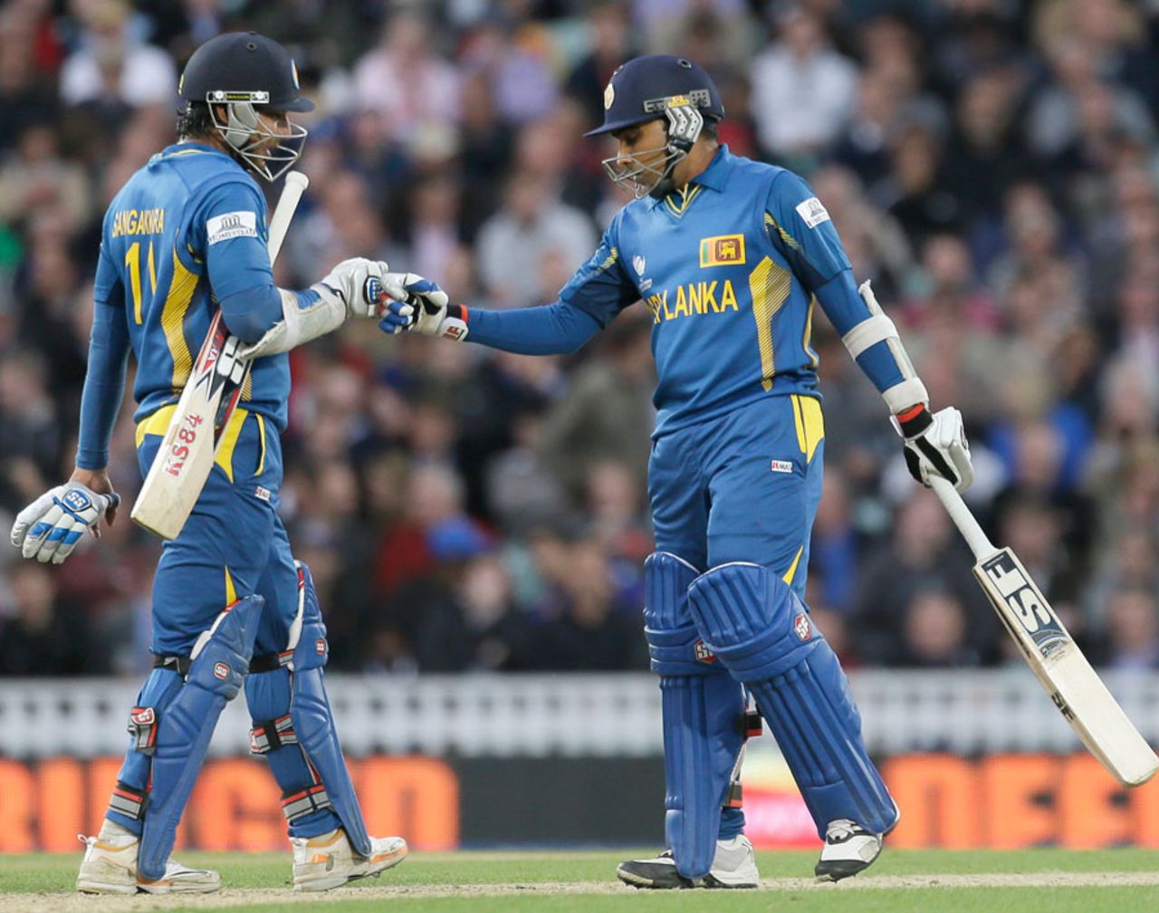 Kumar Sangakkara and Mahela Jayawardene punch gloves during their partnership, England v Sri Lanka, Champions Trophy, Group A, The Oval, June 13, 2013