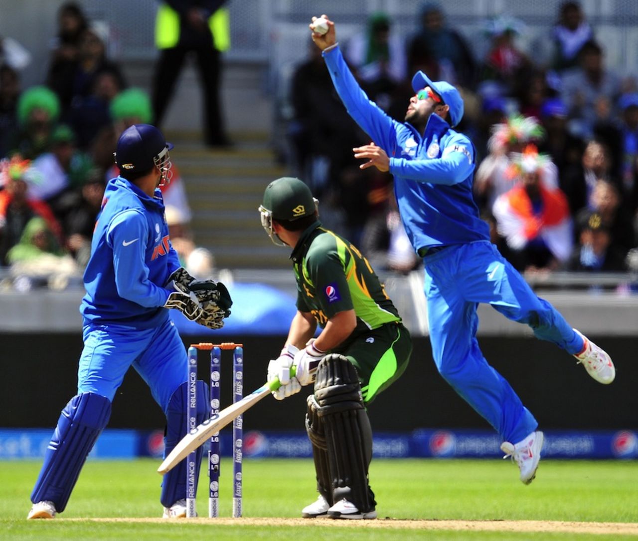 Virat Kohli takes a catch at leg slip, India v Pakistan, Champions Trophy, Group B, Edgbaston, June 15, 2013