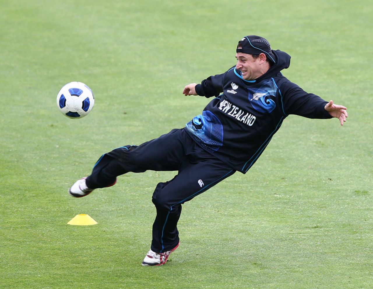 Nathan McCullum has a go in a game of football, Cardiff, June 15, 2013