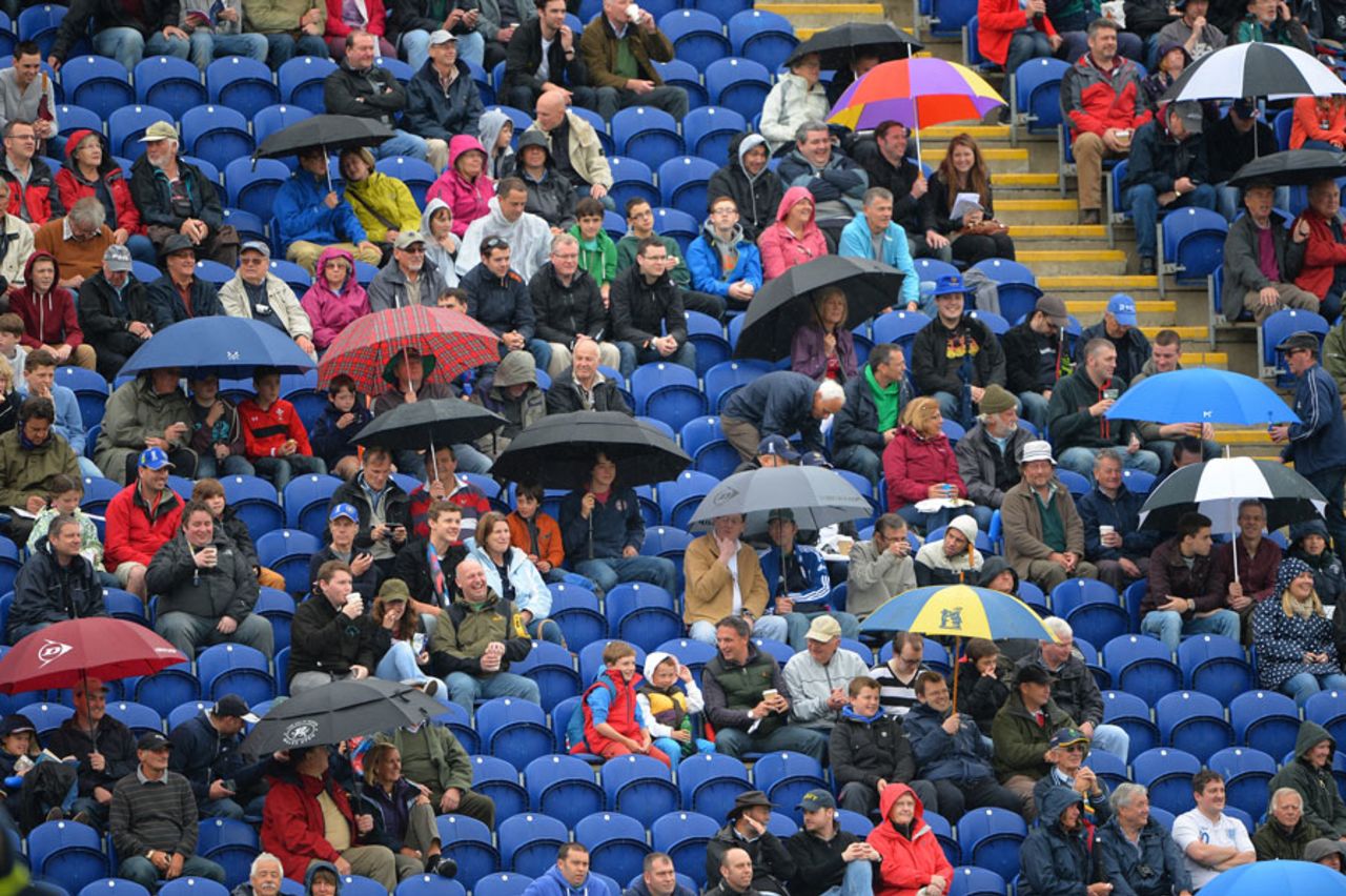The brollies come out as the rain beats down, England v New Zealand, Champions Trophy, Group A, Cardiff, June 16, 2013