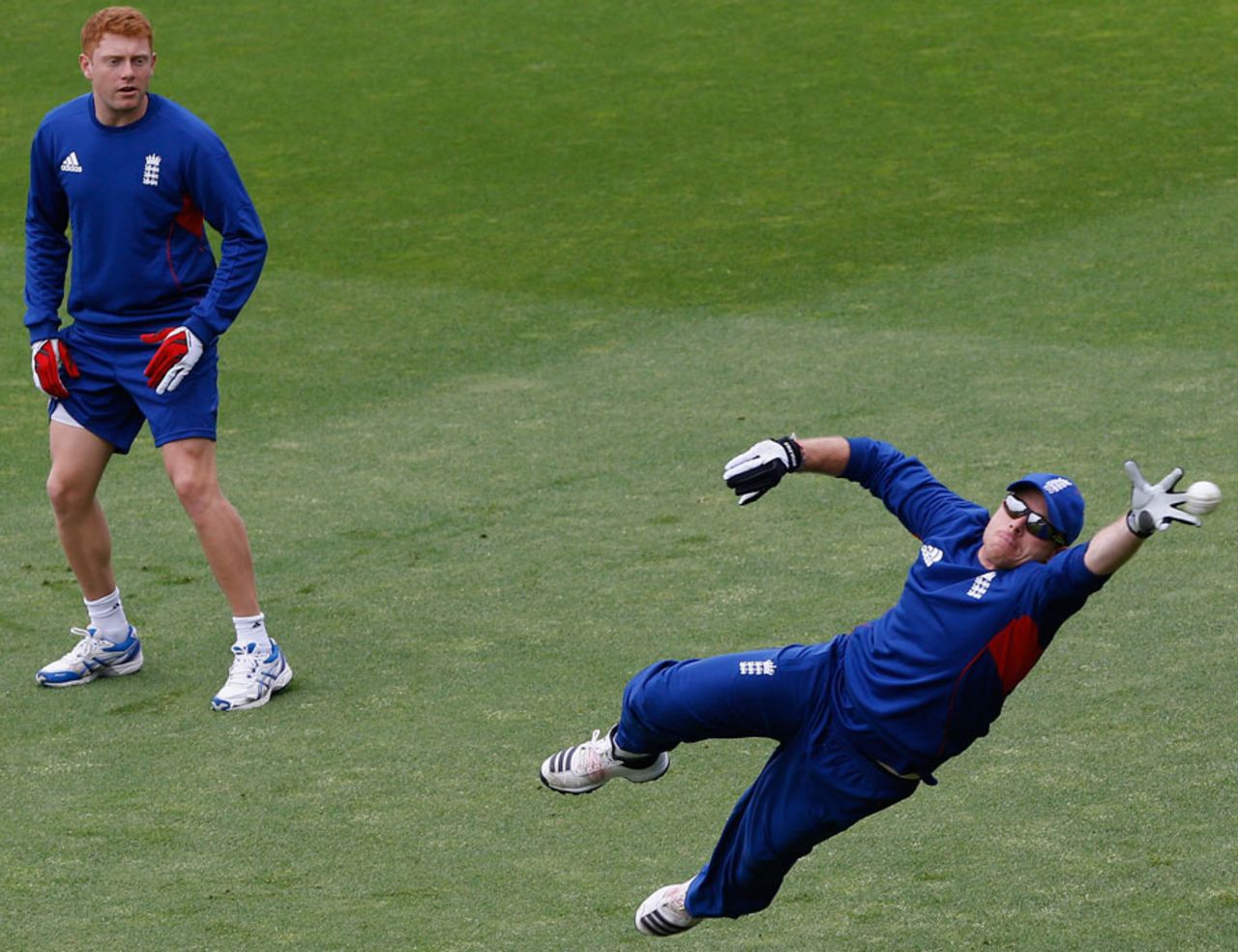 Ian Bell reaches for a catch as Jonny Bairstow looks on, London, June 18, 2013