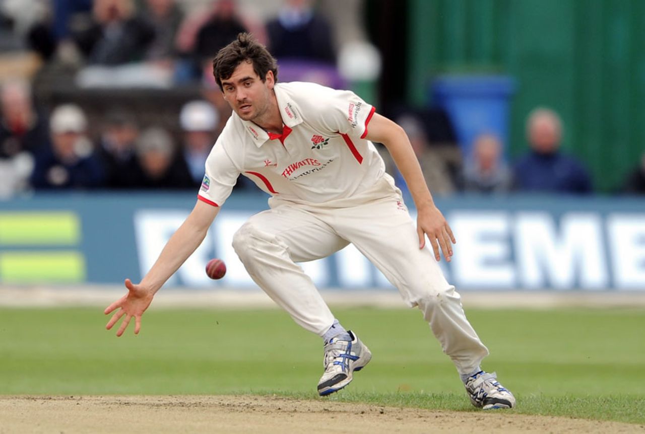 Kyle Hogg fields off his own bowling, Lancashire v Somerset, County Championship, Division One, Aigburth, August, 2, 2012