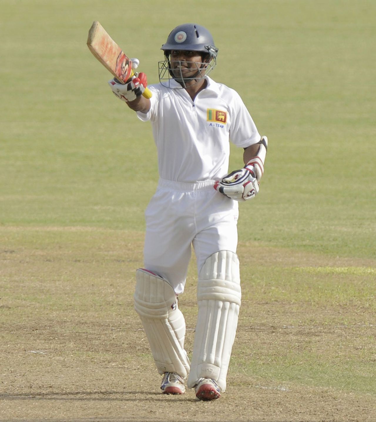 Kaushal Silva raises his bat after scoring a hundred, West Indies A v Sri Lanka A, 2nd unofficial Test, 1st day, Kingstown, June 12, 2013