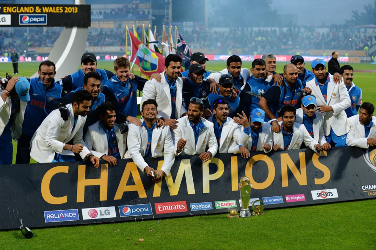 The victorious Indian team pose behind the Champions Trophy banner England v India, Champions Trophy final, Edgbaston, June 23, 2013