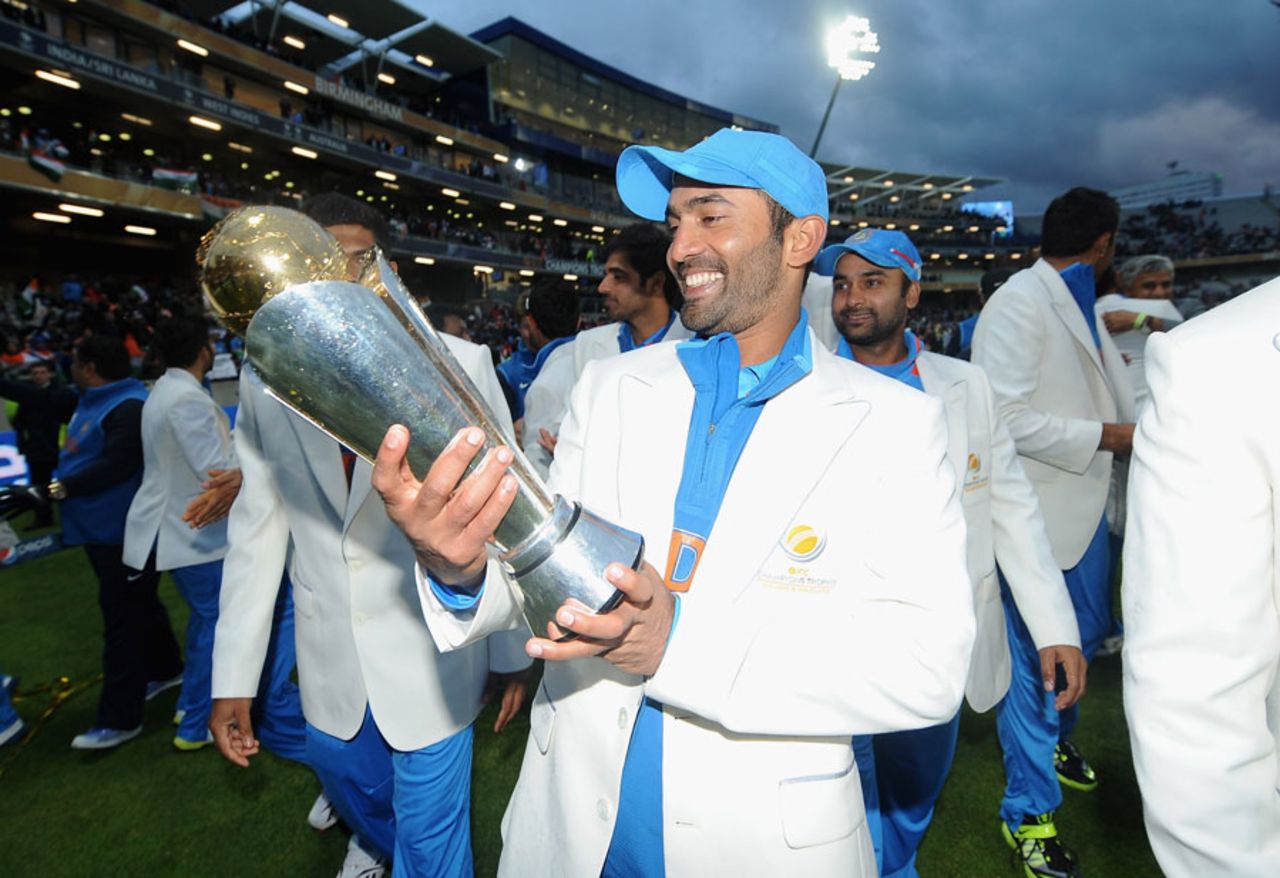 Dinesh Karthik takes in the trophy, England v India, Champions Trophy final, Edgbaston, June 23, 2013