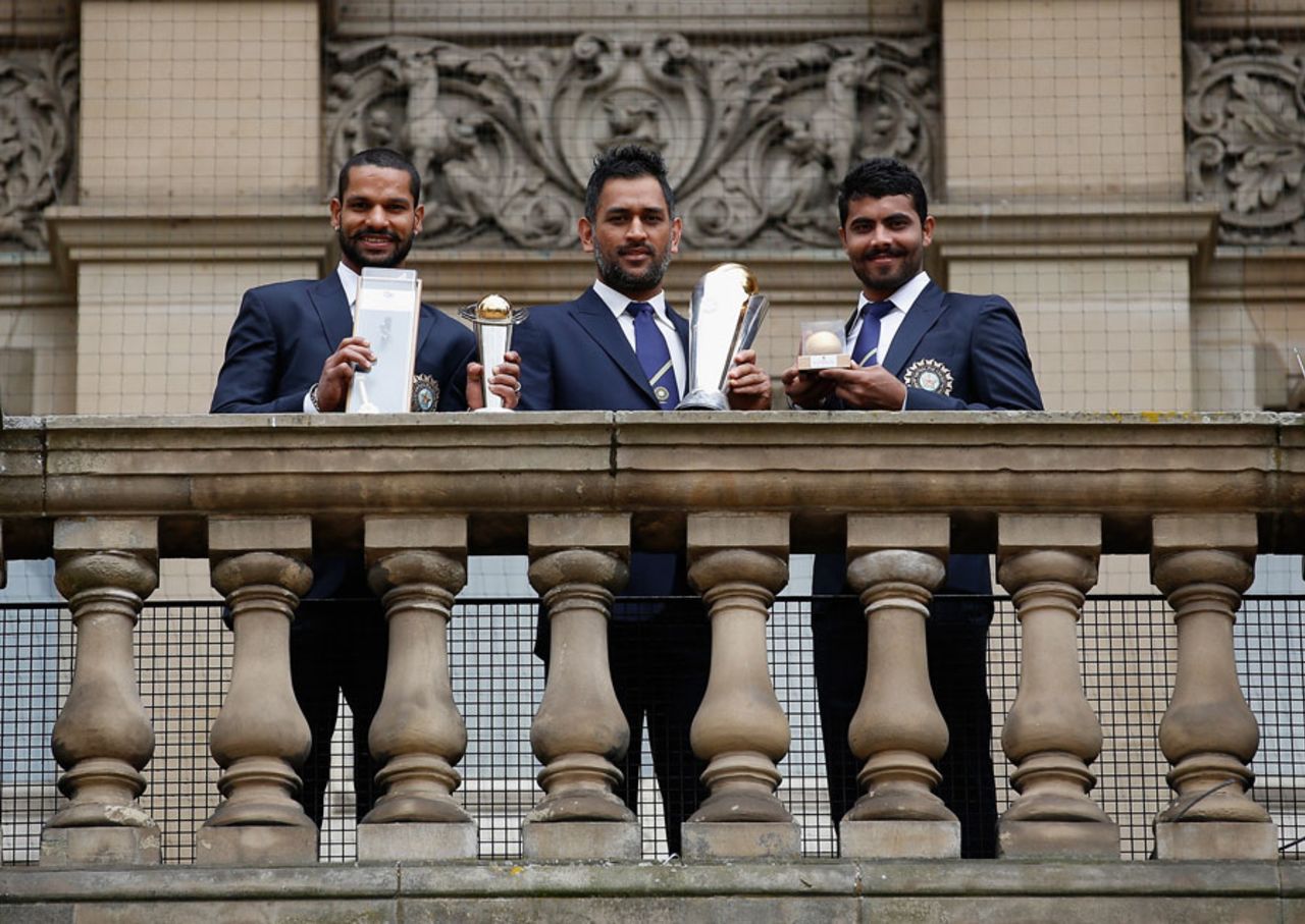 Shikhar Dhawan, MS Dhoni and Ravindra Jadeja with their respective trophies, England v India, Champions Trophy final, Edgbaston, June 23, 2013