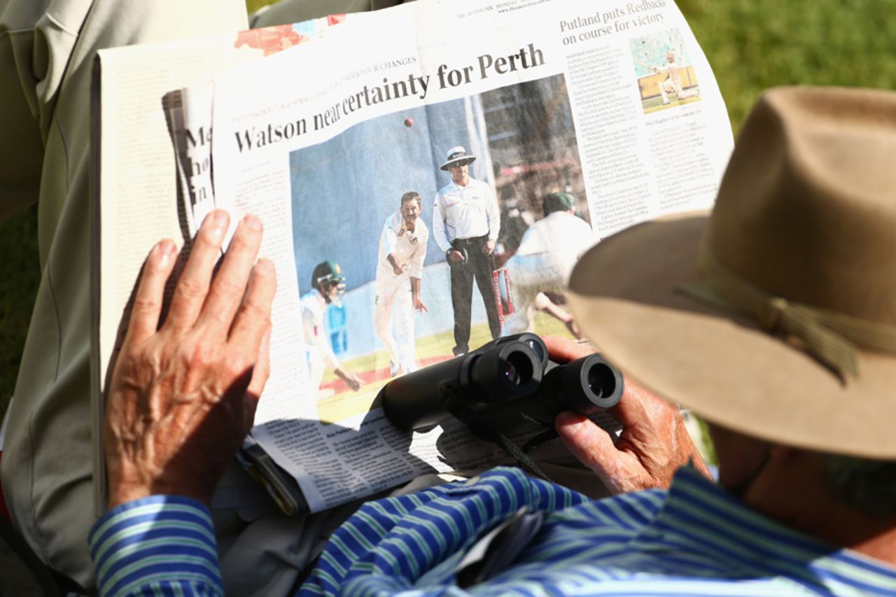 A spectator reads a newspaper, Australia v South Africa, 2nd Test, Adelaide, 5th day, November 26, 2012