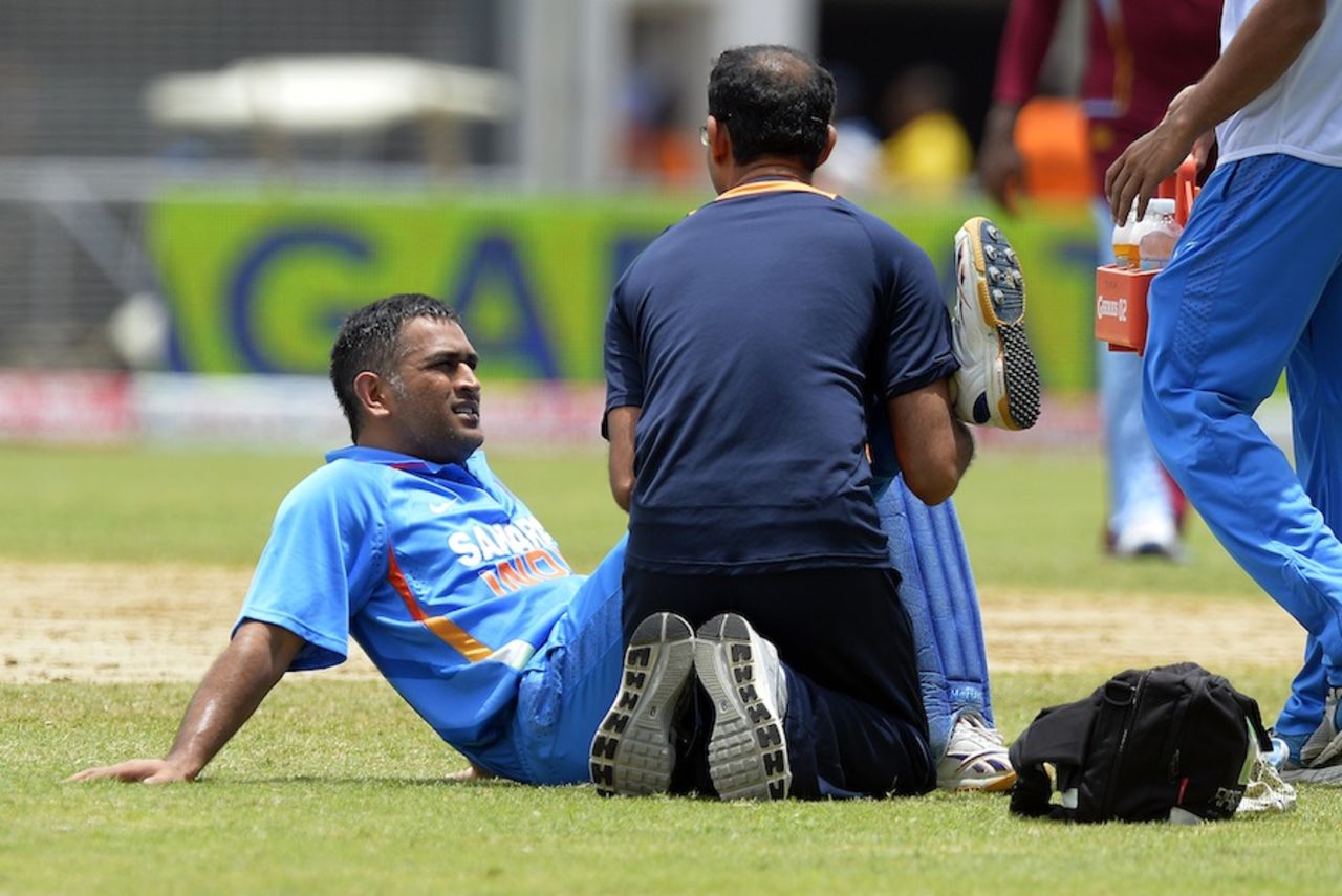 MS Dhoni struggled with an injury, West Indies v India, West Indies tri-series, Kingston, June 30, 2013