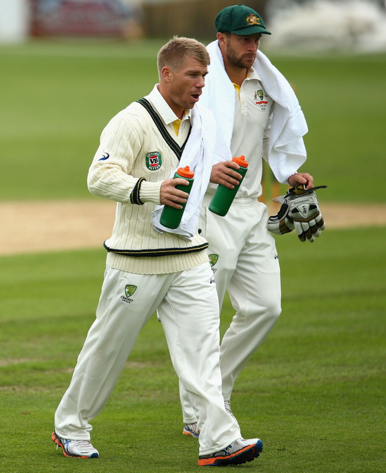 Matthew Wade and the suspended David Warner run drinks to the batsmen, Worcestershire v Australians, Worcester, 1st day, July 2, 2013