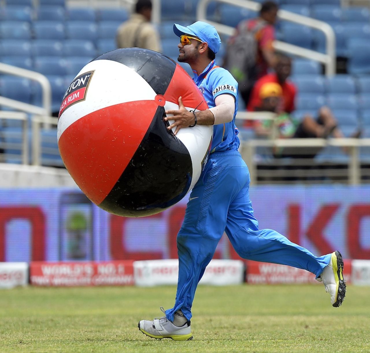 Virat Kohli removes an inflatable ball from the field, India v Sri Lanka, West Indies tri-series, Kingston, July 2, 2013