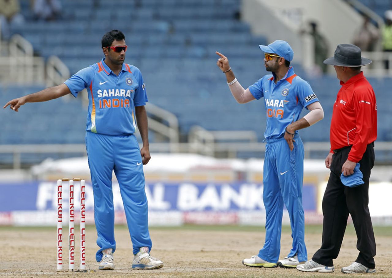Acting captain Virat Kohli gives instructions to R Ashwin, India v Sri Lanka, West Indies tri-series, Kingston, July 2, 2013