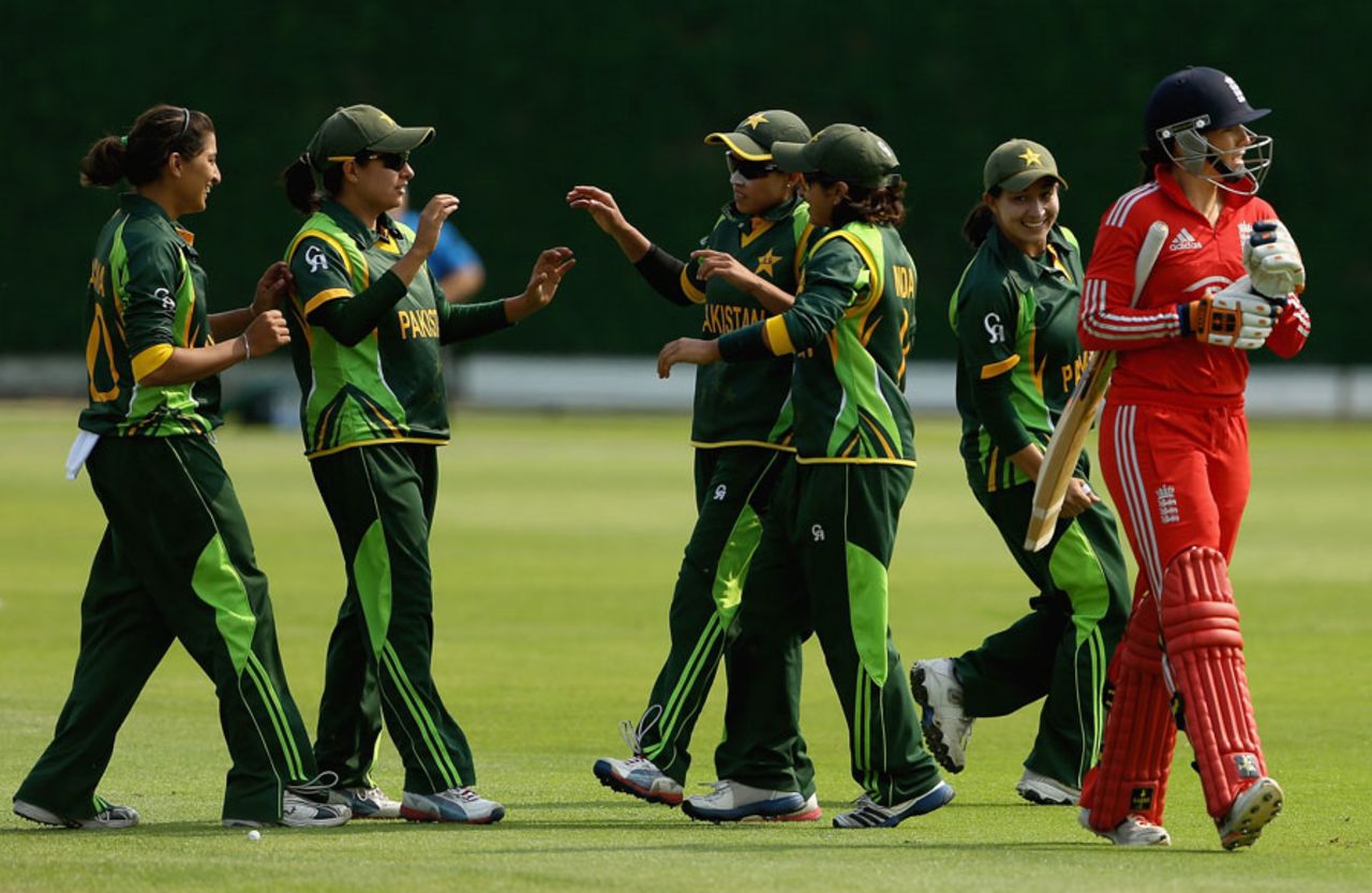 Pakistan players celebrate the wicket of opener Lauren Winfield, England v Pakistan, 1st women's T20, Loughborough, July 5, 2013