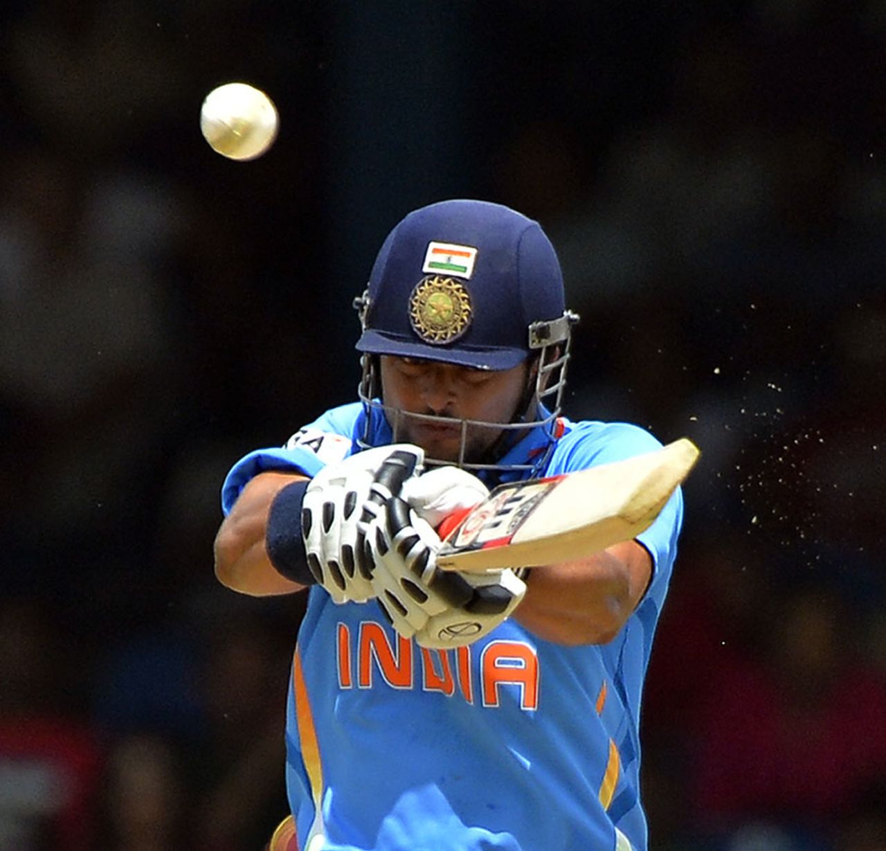 Suresh Raina fends off a short ball, West Indies v India, West Indies tri-series, Port of Spain, July 5, 2013
