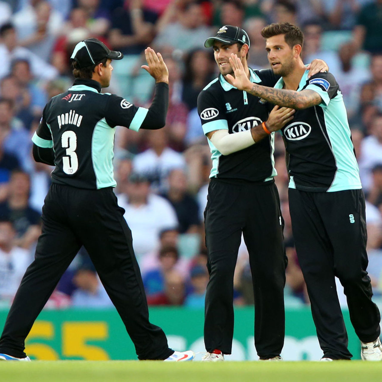 Jade Dernbach celebrates with Glenn Maxwell and Ricky Ponting, Surrey v Middlesex, FLt20, South Group, The Oval, July 5, 2013