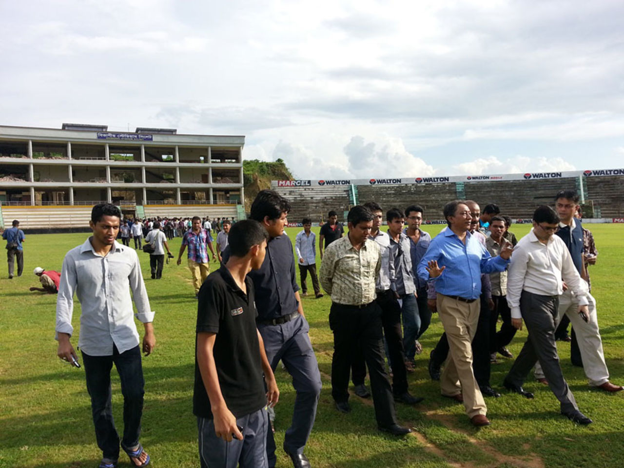 BCB President Nazmul Hassan leads a group of people onto Sylhet Divisional Stadium, Sylhet, July 8, 2013