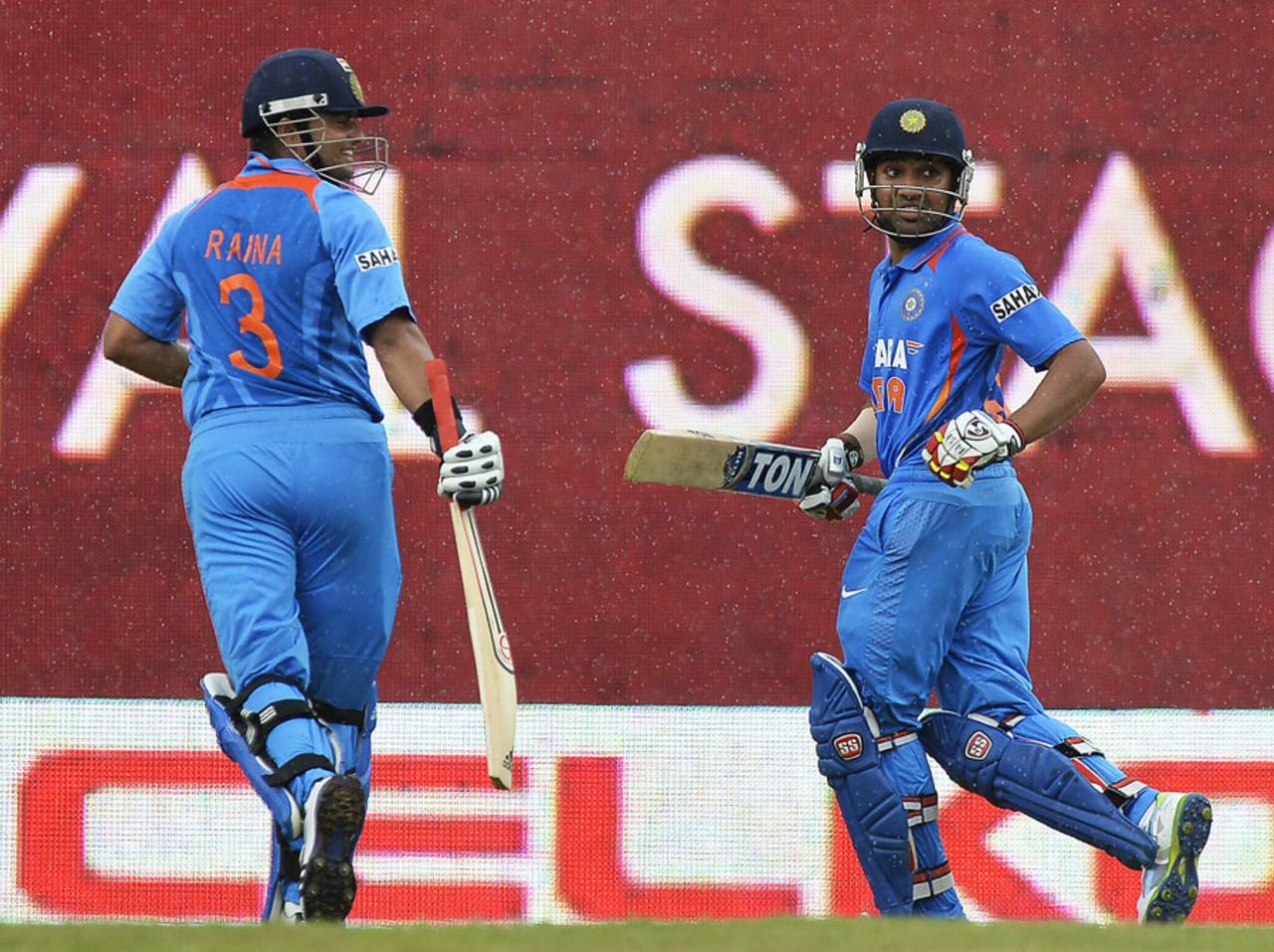 Rain forces Rohit Sharma and Suresh Raina to rush off the field, India v Sri Lanka, West Indies tri-series, Port-of-Spain, July 9, 2013