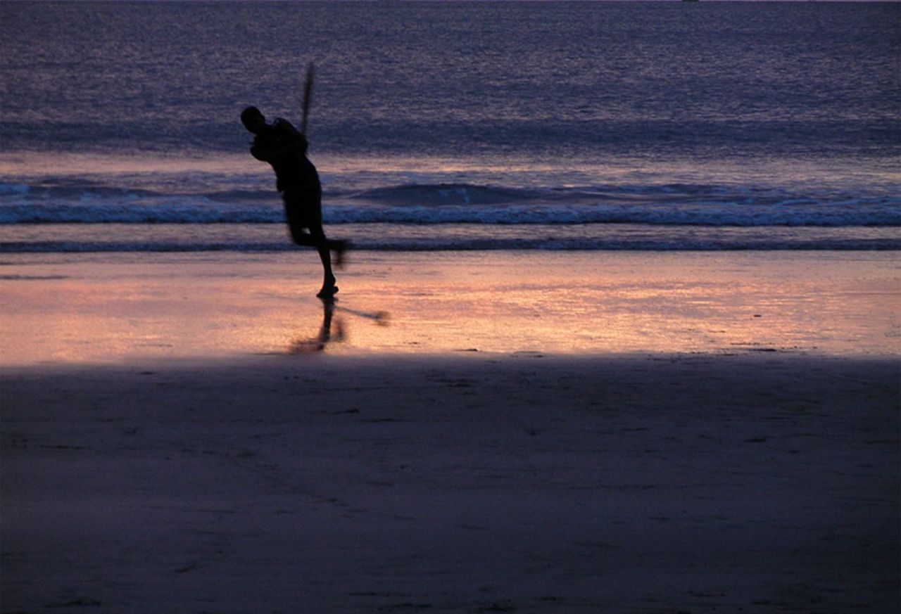 <b>Bappaditya Gole:</b> The sunlight reflecting off the wet sand at Kudle beach near Gokarna in Karnataka  makes it look like the silhouetted batsman is playing on a shiny pitch. And he's playing a rather photo-perfect flick shot, invoking some of Azharuddin's insouciance