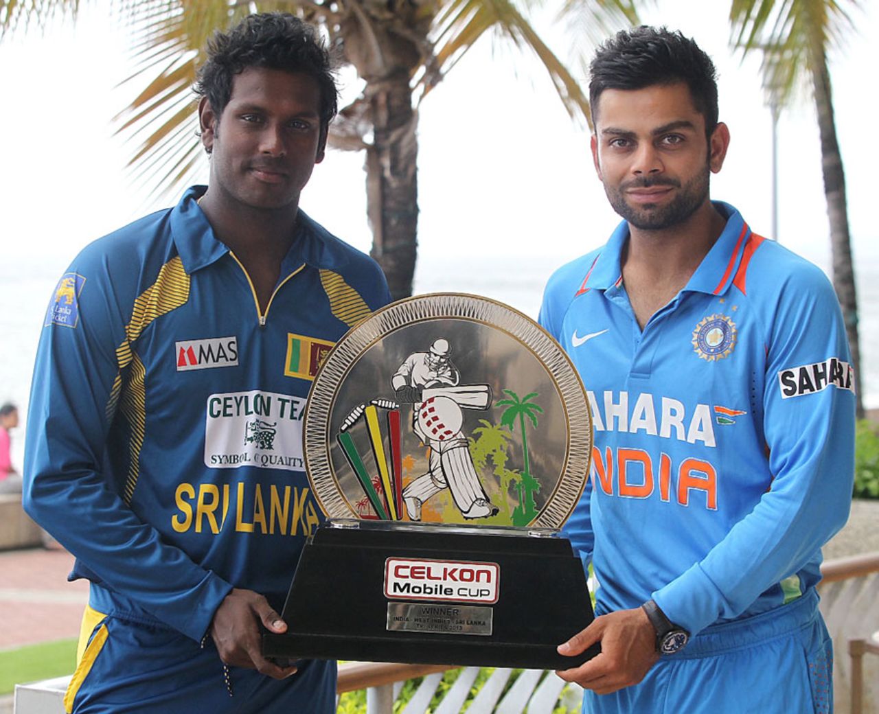 Virat Kohli and Angelo Mathews pose with the trophy, India v Sri Lanka, tri-series final, Port-of-Spain, July 10, 2013
