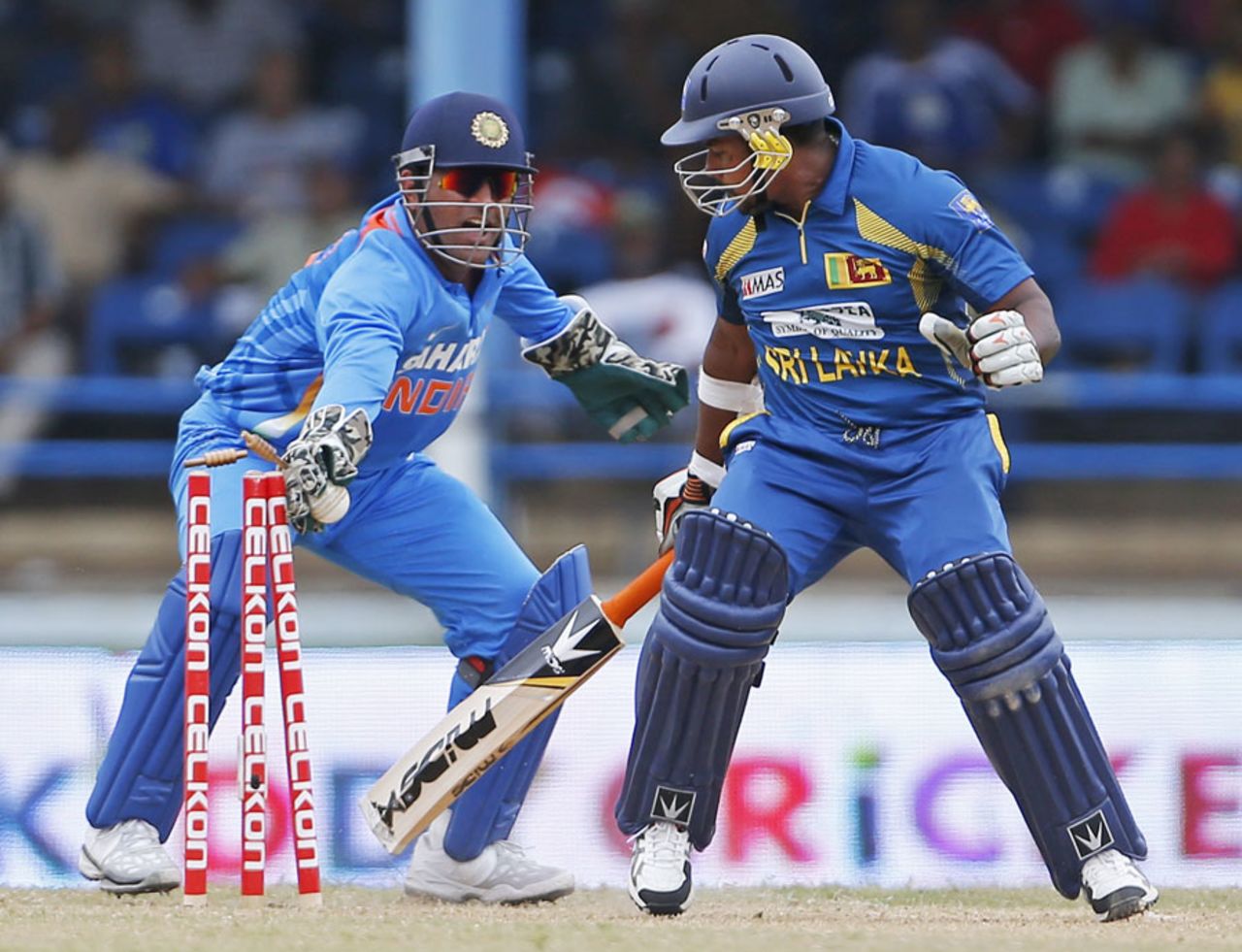 Rangana Herath looks on as MS Dhoni stumps him, India v Sri Lanka, tri-series final, Port-of-Spain, July 11, 2013