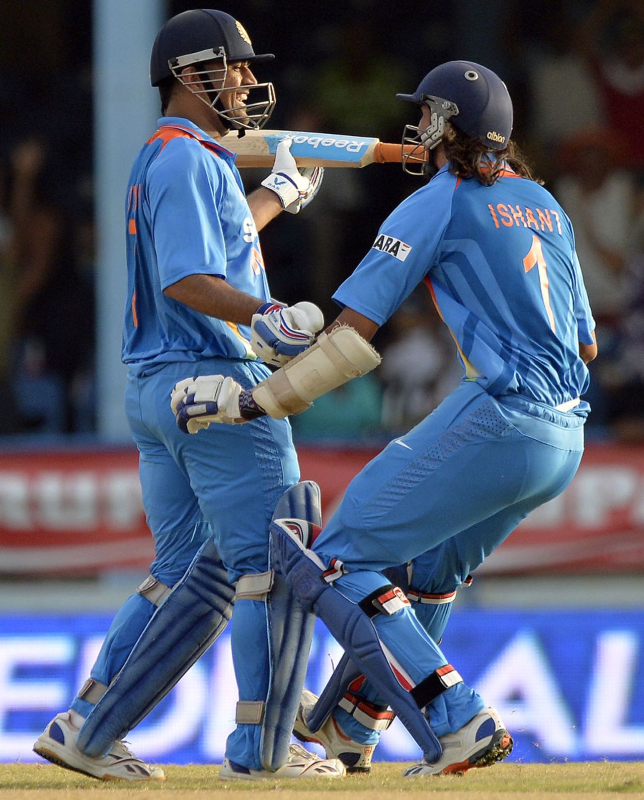 A joyous MS Dhoni and Ishant Sharma after the win, India v Sri Lanka, tri-series final, Port-of-Spain, July 11, 2013