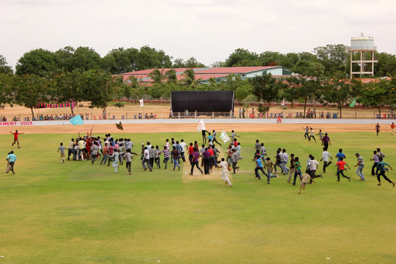 The crowd invades the field at the end of the Rural District Tournament, Anantapur, Andhra Pradesh, July 2013