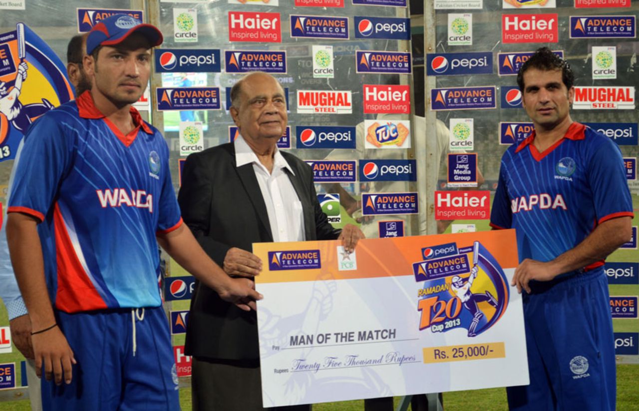 Mohammad Ayub (right) poses with the Man of the Match cheque, United Bank Limited v Water and Power Development Authority, Ramadan T20 Cup, Group A, Karachi, July 12, 2013