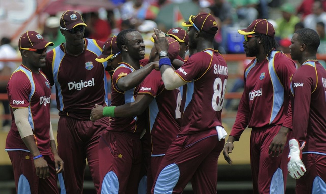 Kemar Roach is congratulated by team-mates, West Indies v Pakistan, 1st ODI, Providence, July 14, 2013