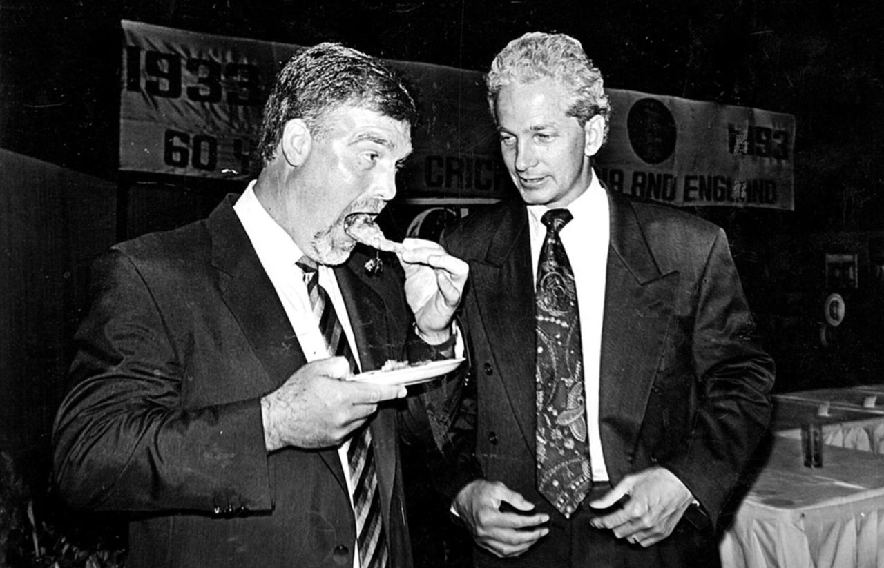 Mike Gatting poses with a plate of prawns as David Gower looks on, on the tour of India in 1992-93