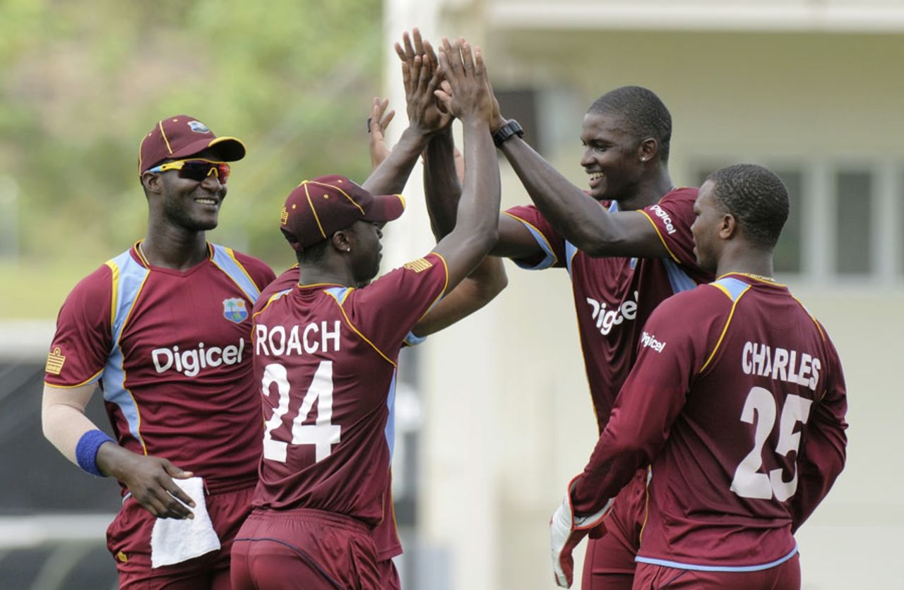 Jason Holder and Kemar Roach celebrate Ahmed Shehzad's wicket, West Indies v Pakistan, 3rd ODI, St Lucia, July 19, 2013