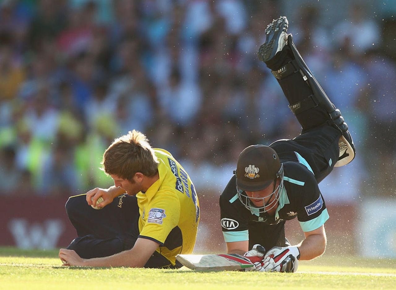 Gary Wilson and Liam Dawson have a collision, Surrey v Hampshire, FLt20, South Group, The Oval, July 19, 2013