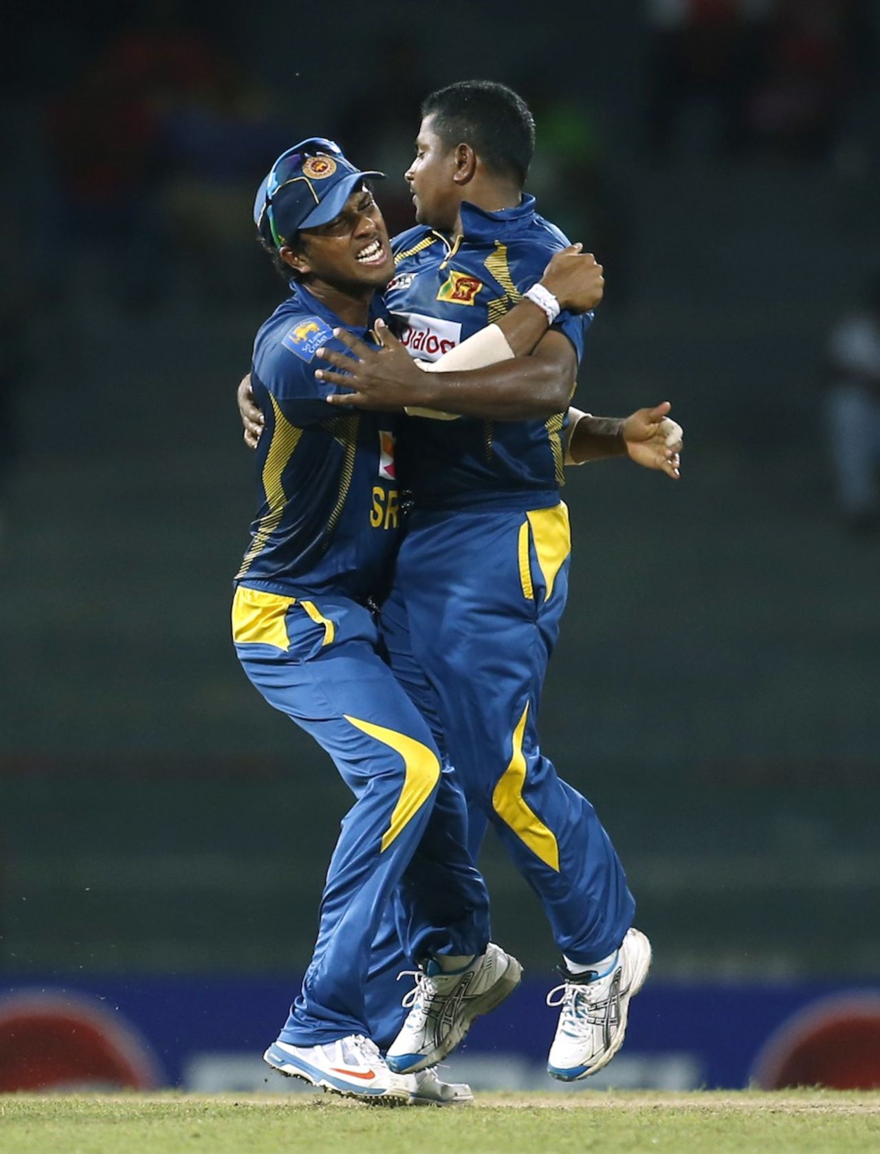 Dinesh Chandimal hugs Rangana Herath after AB de Villiers' wicket, Sri Lanka v South Africa, 1st ODI, Colombo, July 20, 2013