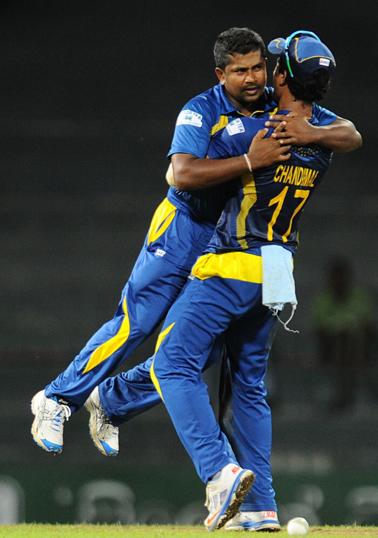 Rangana Herath and Dinesh Chandimal celebrate a wicket, Sri Lanka v South Africa, 2nd ODI, Colombo, July 23, 2013