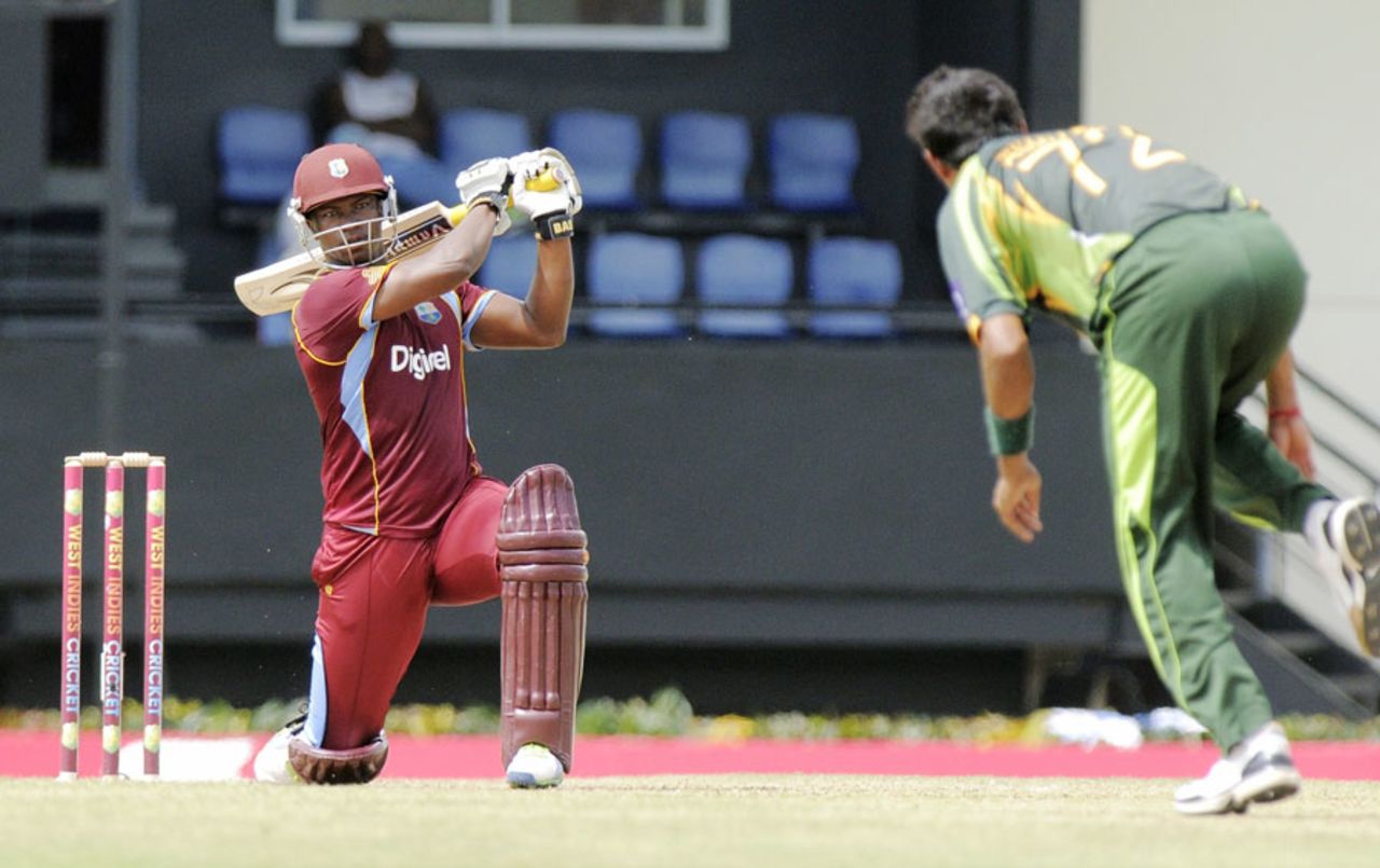 Johnson Charles on one knee after driving the ball, West Indies v Pakistan, 5th ODI, St Lucia, July 24, 2013