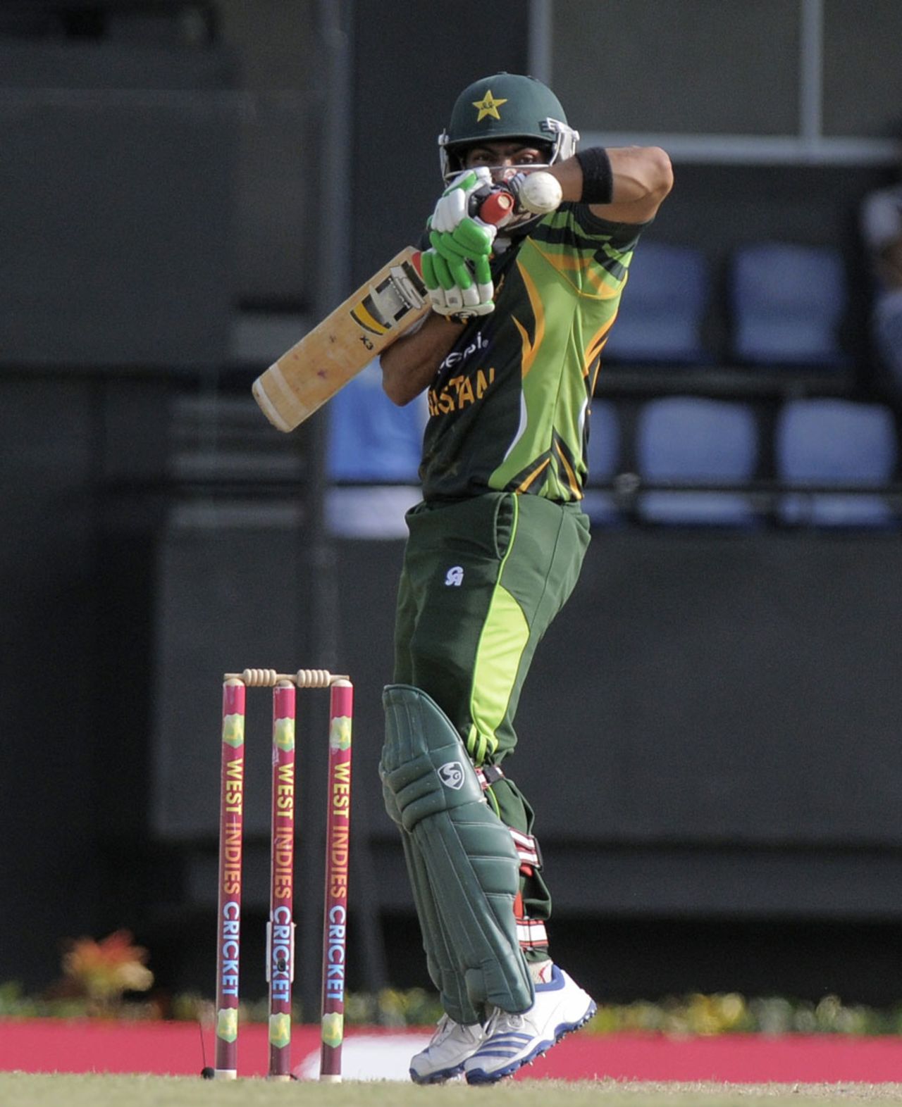 Umar Akmal fends off a bouncer, West Indies v Pakistan, 5th ODI, St Lucia, July 24, 2013