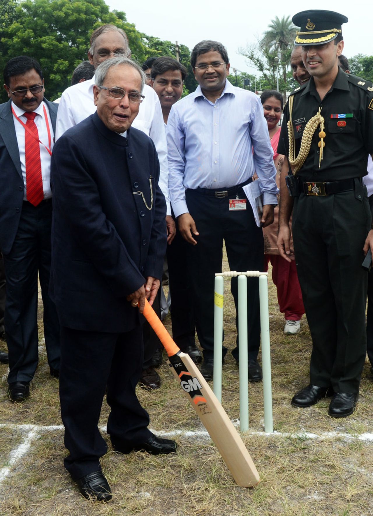 India's president Pranab Mukherjee tries his hand at cricket during the inauguration of a new cricket ground at the Presidential Estate to mark his first year in term, New Delhi, July 25, 2013