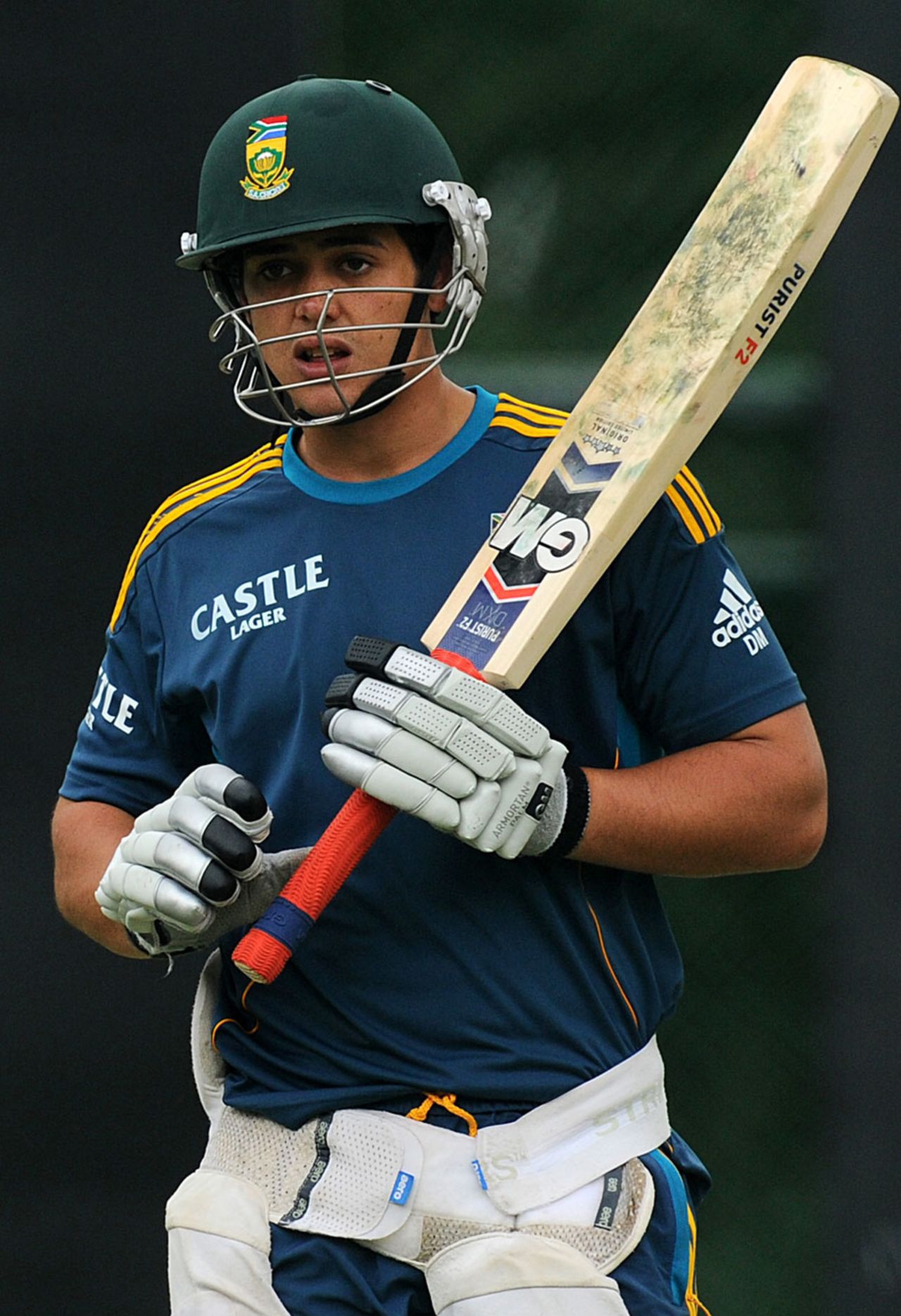 Quinton de Kock walks out to bat during a practice session, Pallekele, July 25, 2013