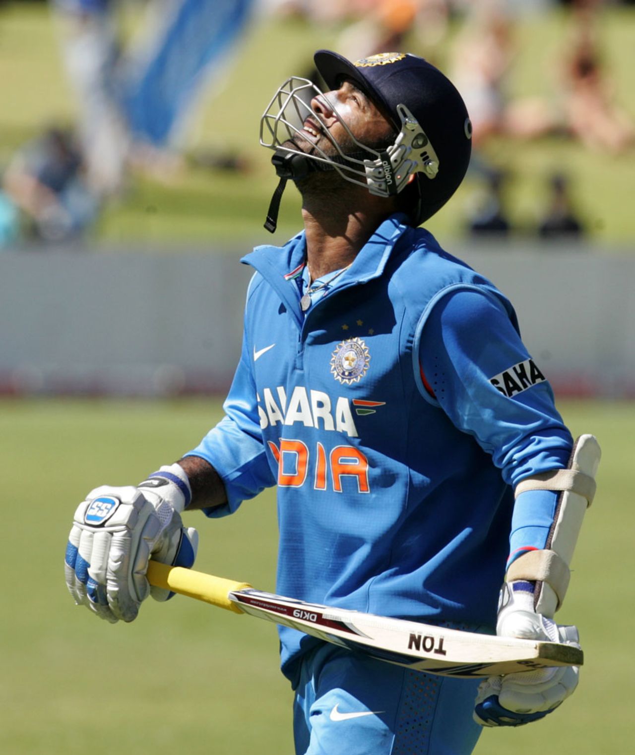 Dinesh Karthik walks back after being run-out for 69, Zimbabwe v India, 2nd ODI, Harare, July 26, 2013