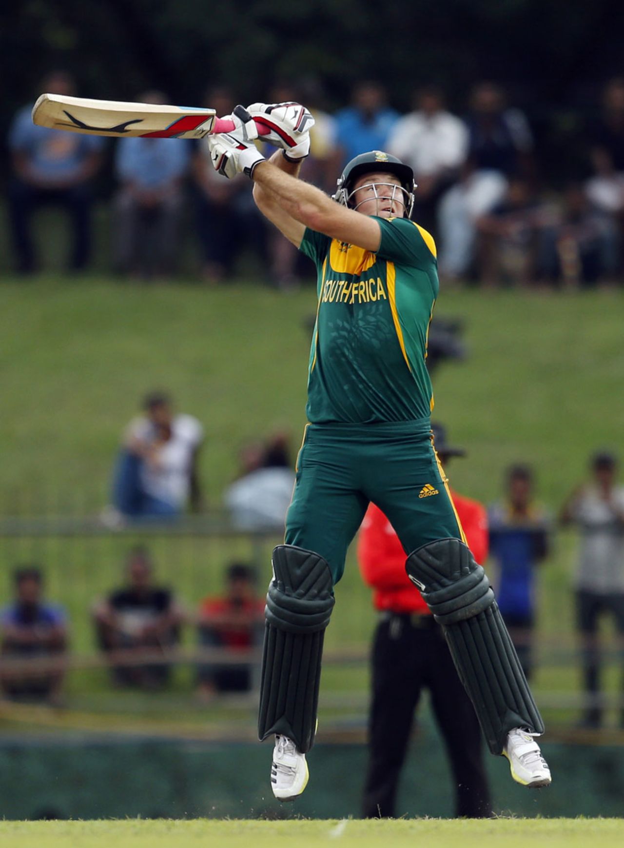 David Miller leaps off his feet while playing an upper cut, Sri Lanka v South Africa, 3rd ODI, Pallekele, July 26, 2013
