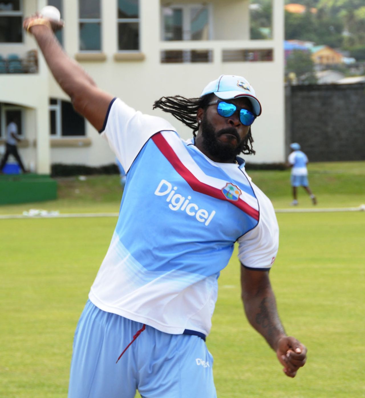 Chris Gayle throws the ball at a practice session, St Vincent, July 25, 2013 