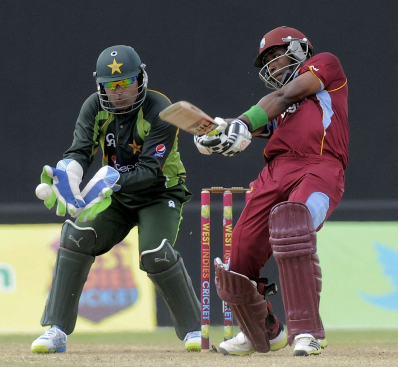 Dwayne Bravo hits the ball to the off side, West Indies v Pakistan, 1st T20I, St Vincent, July 27, 2013