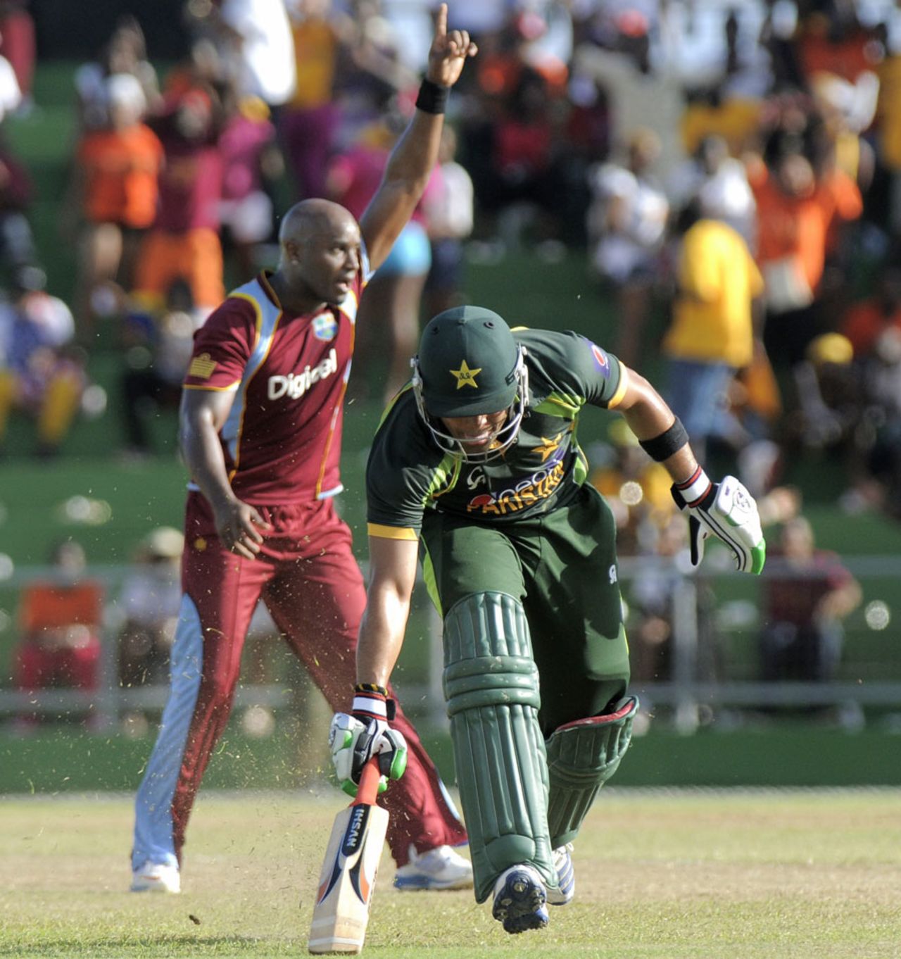 Umar Akmal was run-out by Darren Sammy for 9, West Indies v Pakistan, 1st T20I, St Vincent, July 27, 2013