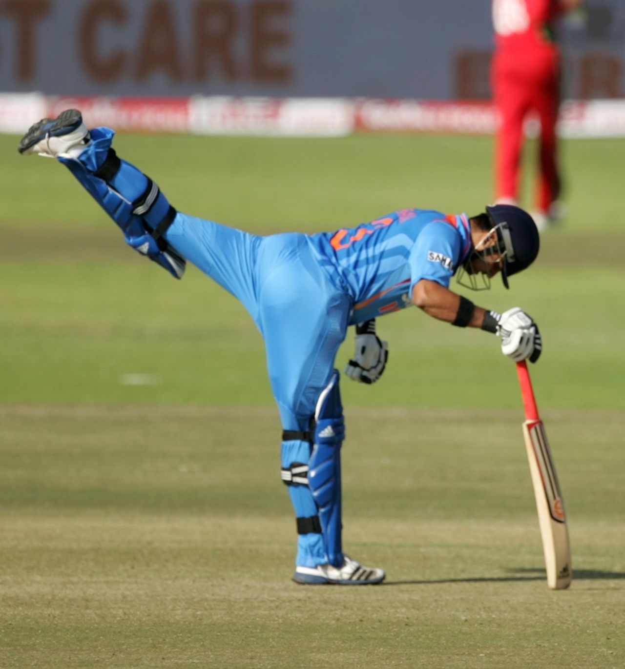 Suresh Raina stretches his muscles before the start of his innings, Zimbabwe v India, 3rd ODI, Harare, July 28, 2013