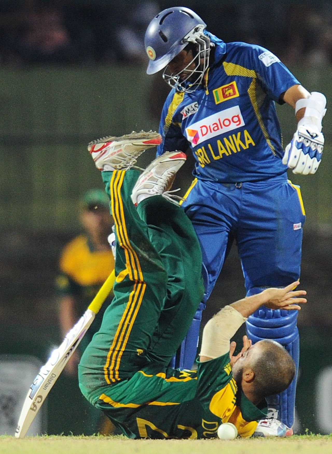 JP Duminy hits the floor after a collision with Tillakaratne Dilshan, Sri Lanka v South Africa, 4th ODI, Pallekele, July 28, 2013