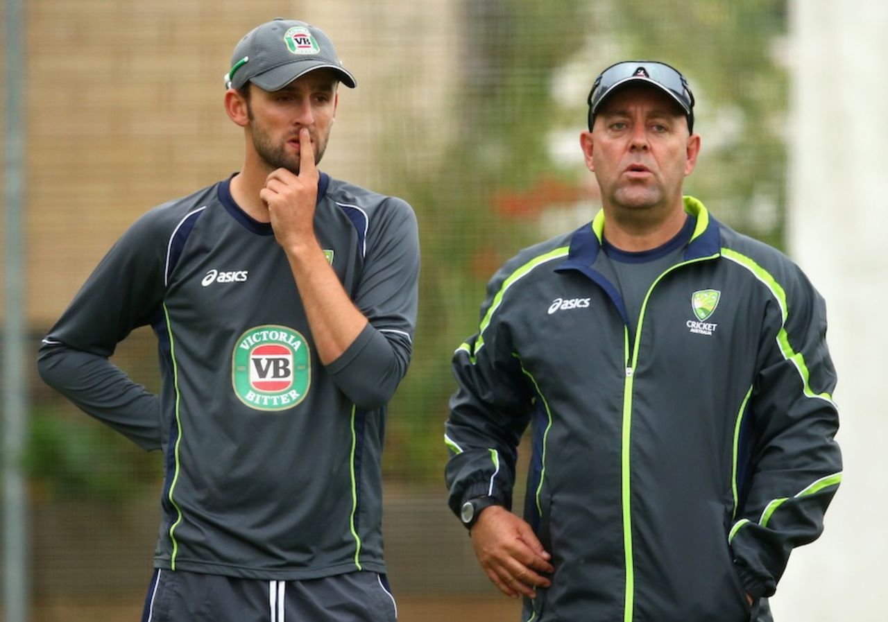 Nathan Lyon and Darren Lehmann chat while training, Hove, July 25, 2013