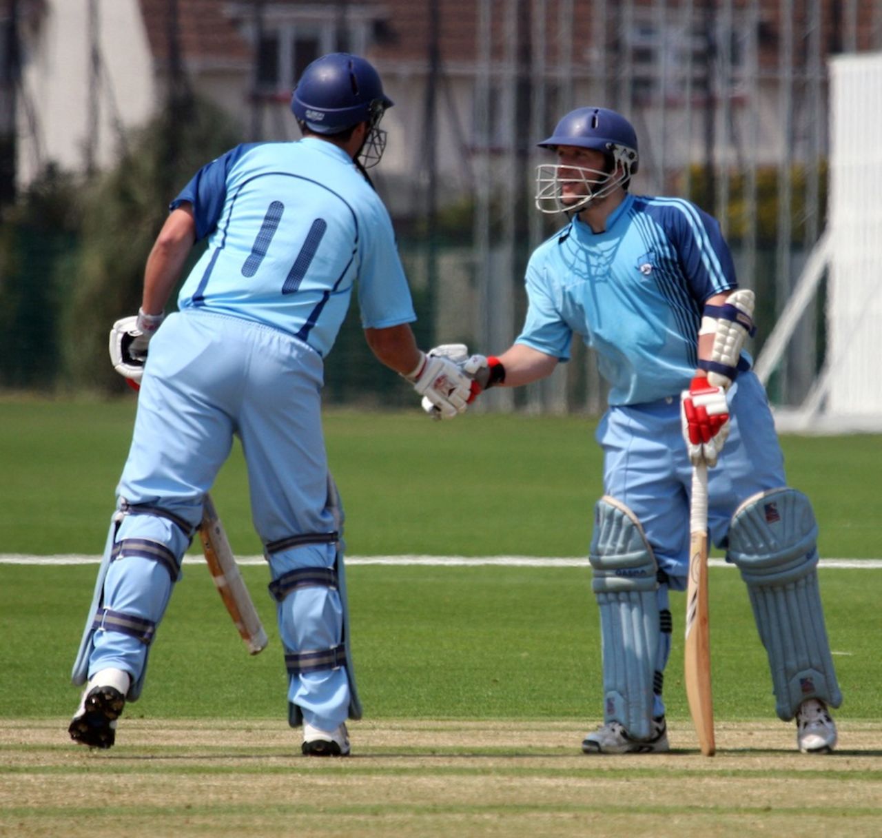 Pablo Ferguson is congratulated after reaching his fifty, Argentina v Vanuatu, ICC World Cricket League Division Six, St Clement, July 22, 2013